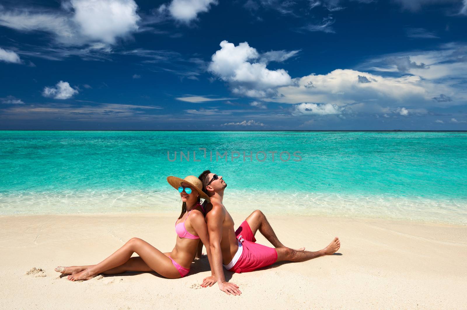 Couple on a beach at Maldives by haveseen