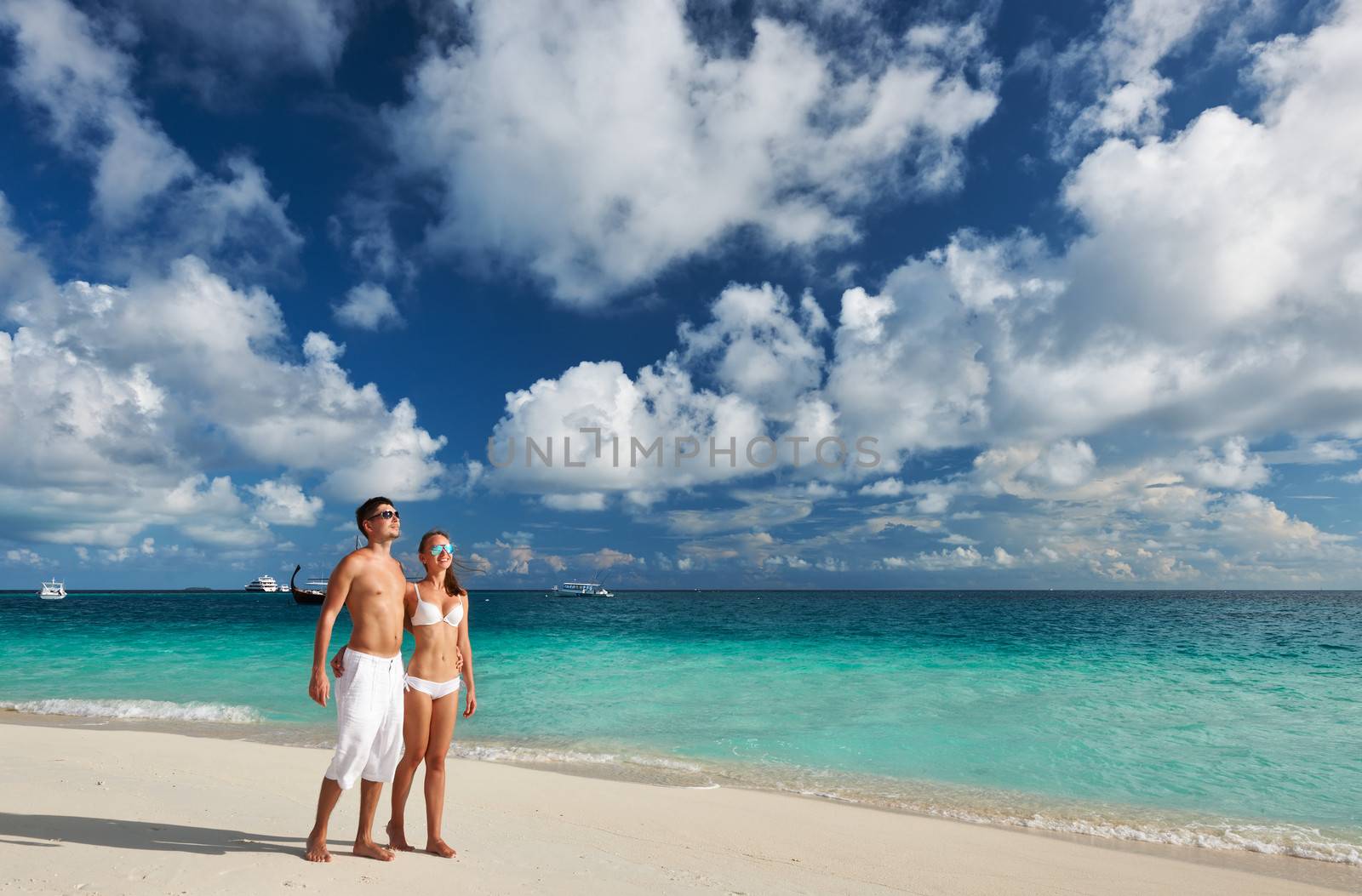 Couple on a tropical beach at Maldives