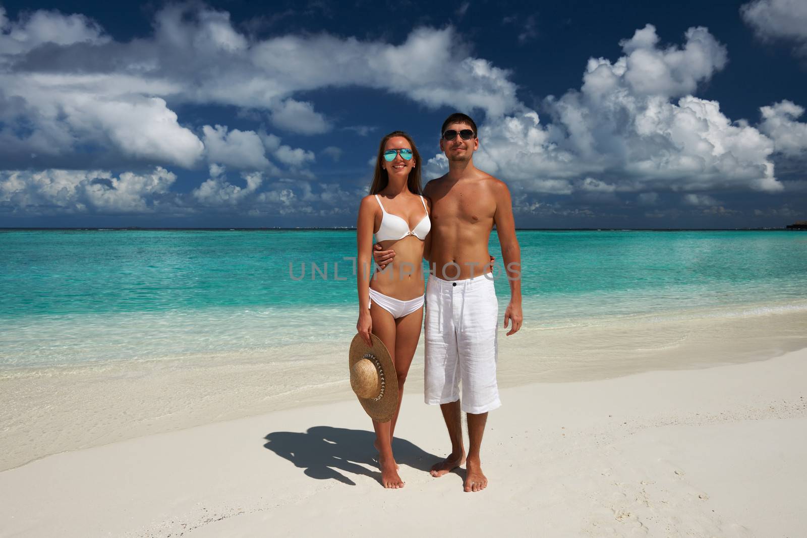 Couple on a tropical beach at Maldives