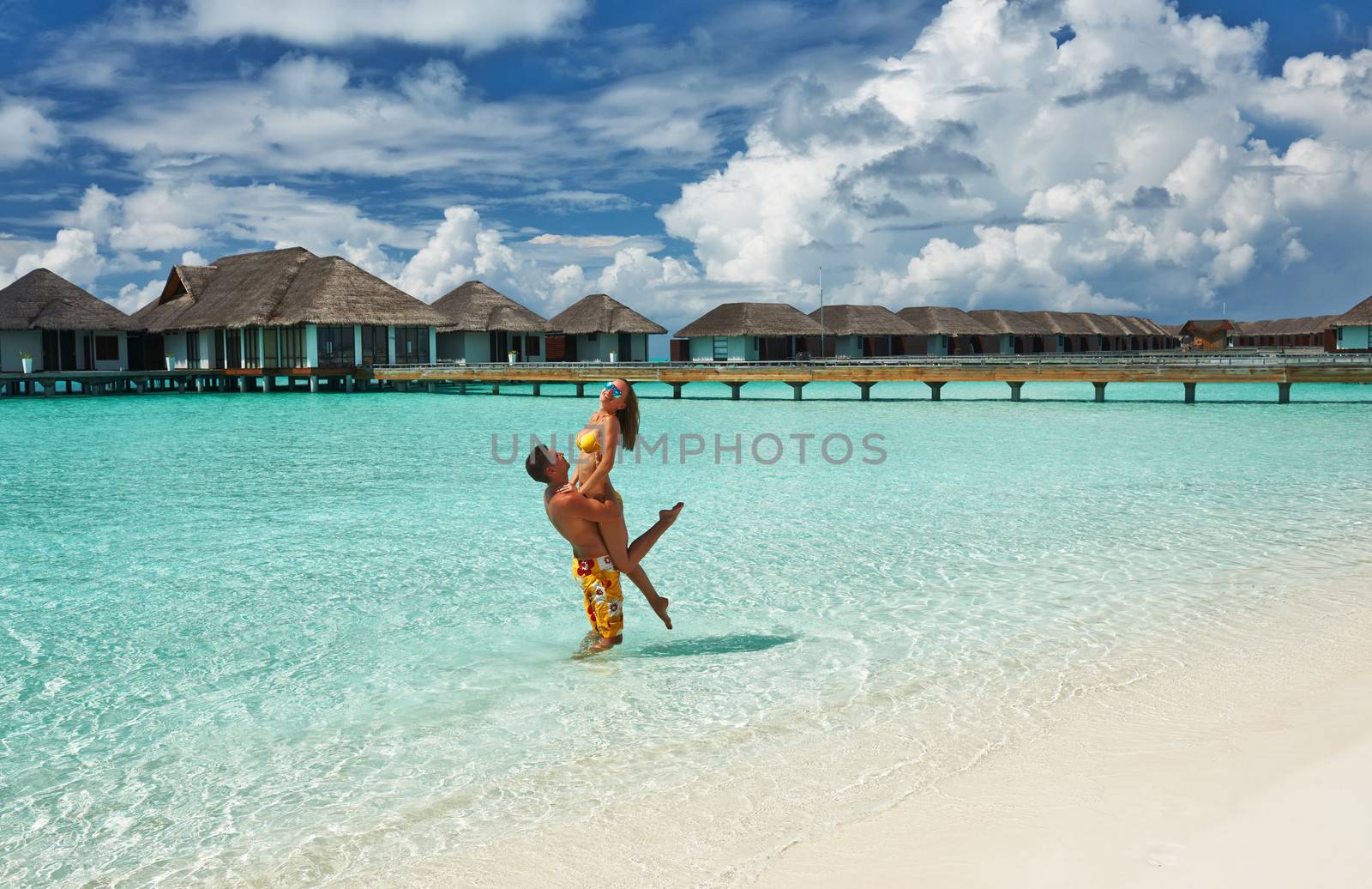 Couple on a tropical beach at Maldives