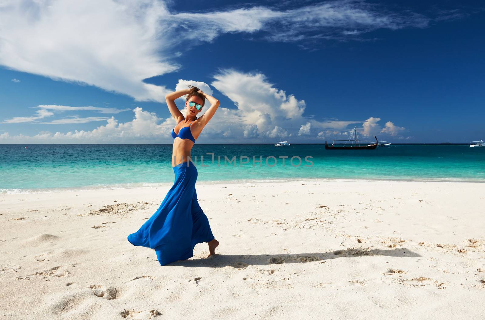 Woman in skirt at tropical beach