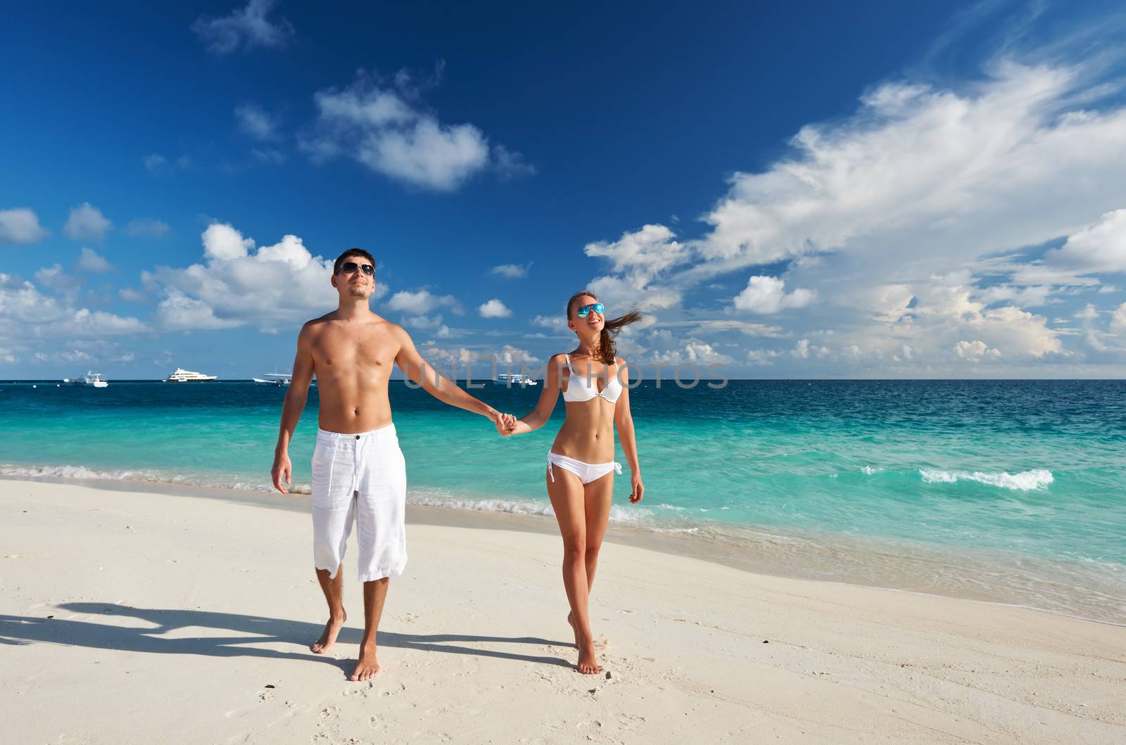 Couple on a tropical beach at Maldives