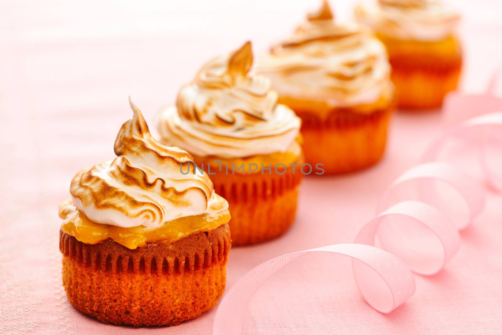 Cupcakes with whipped cream and icing