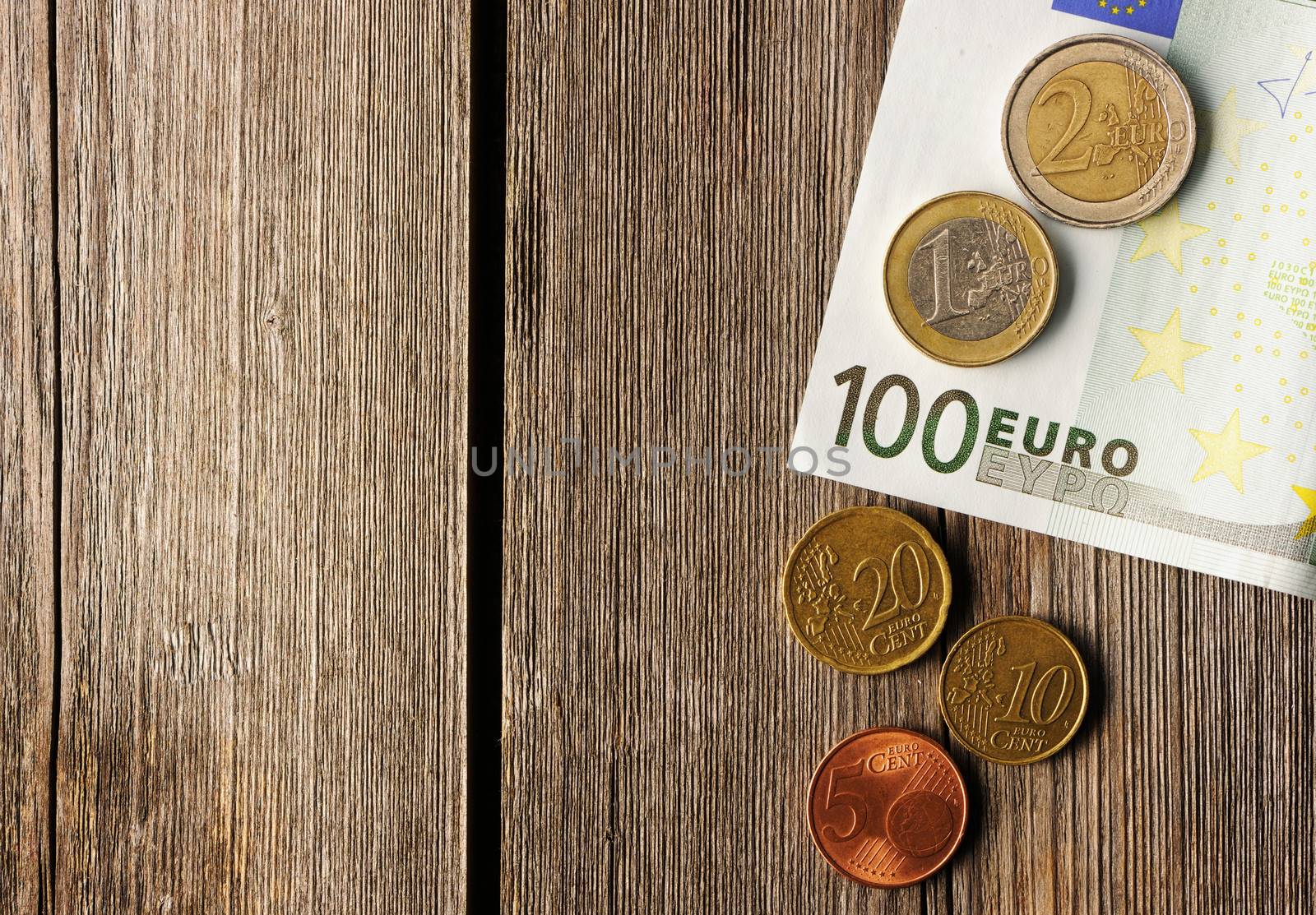 Euro currency over wooden background