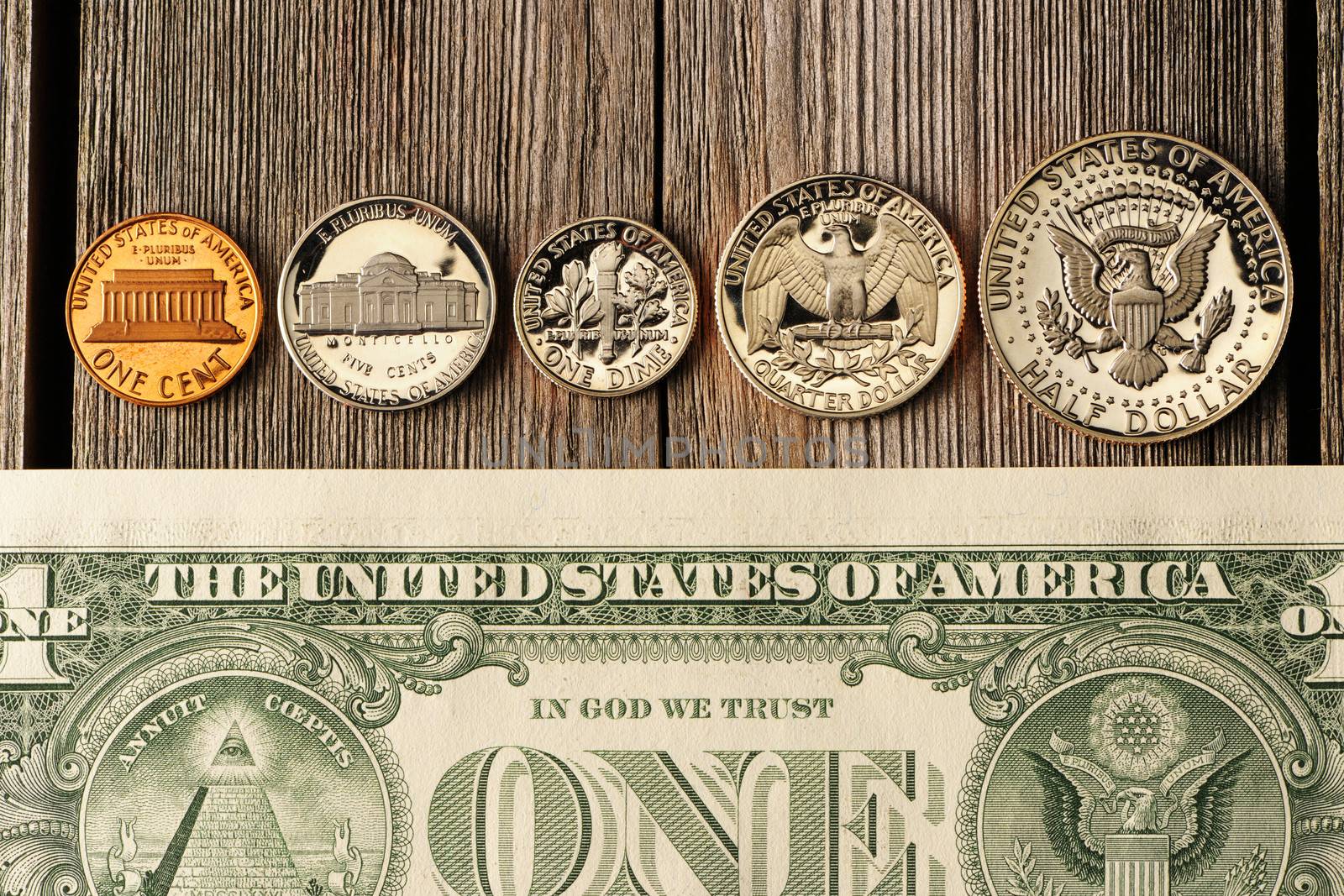 New uncirculated US money over wooden background