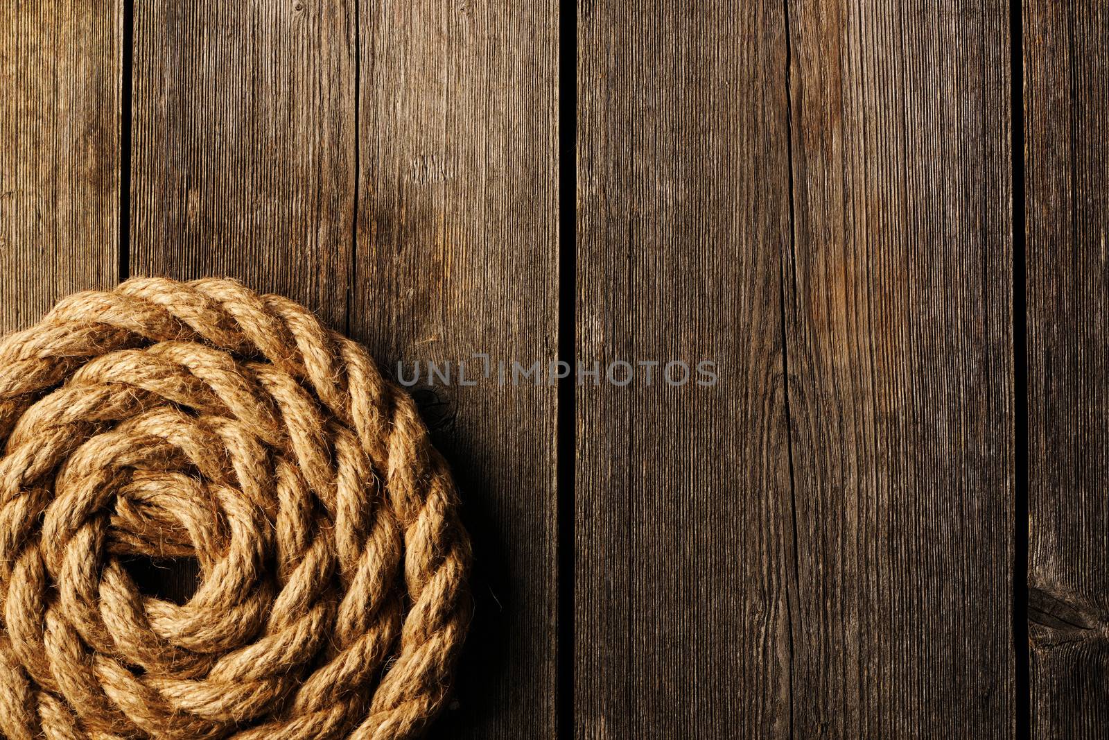 Rope over old wooden background