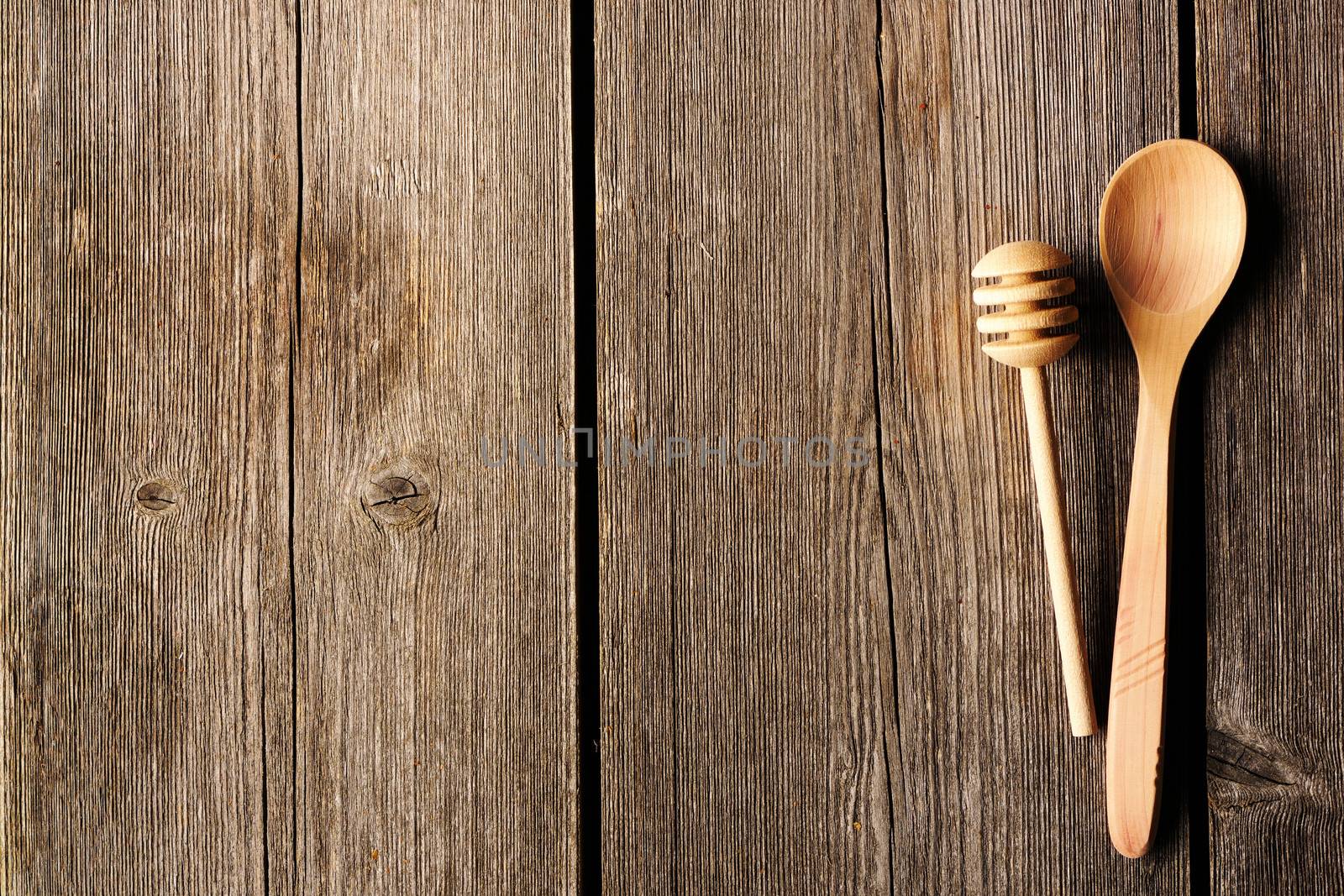 Wooden spoon and dipper on table