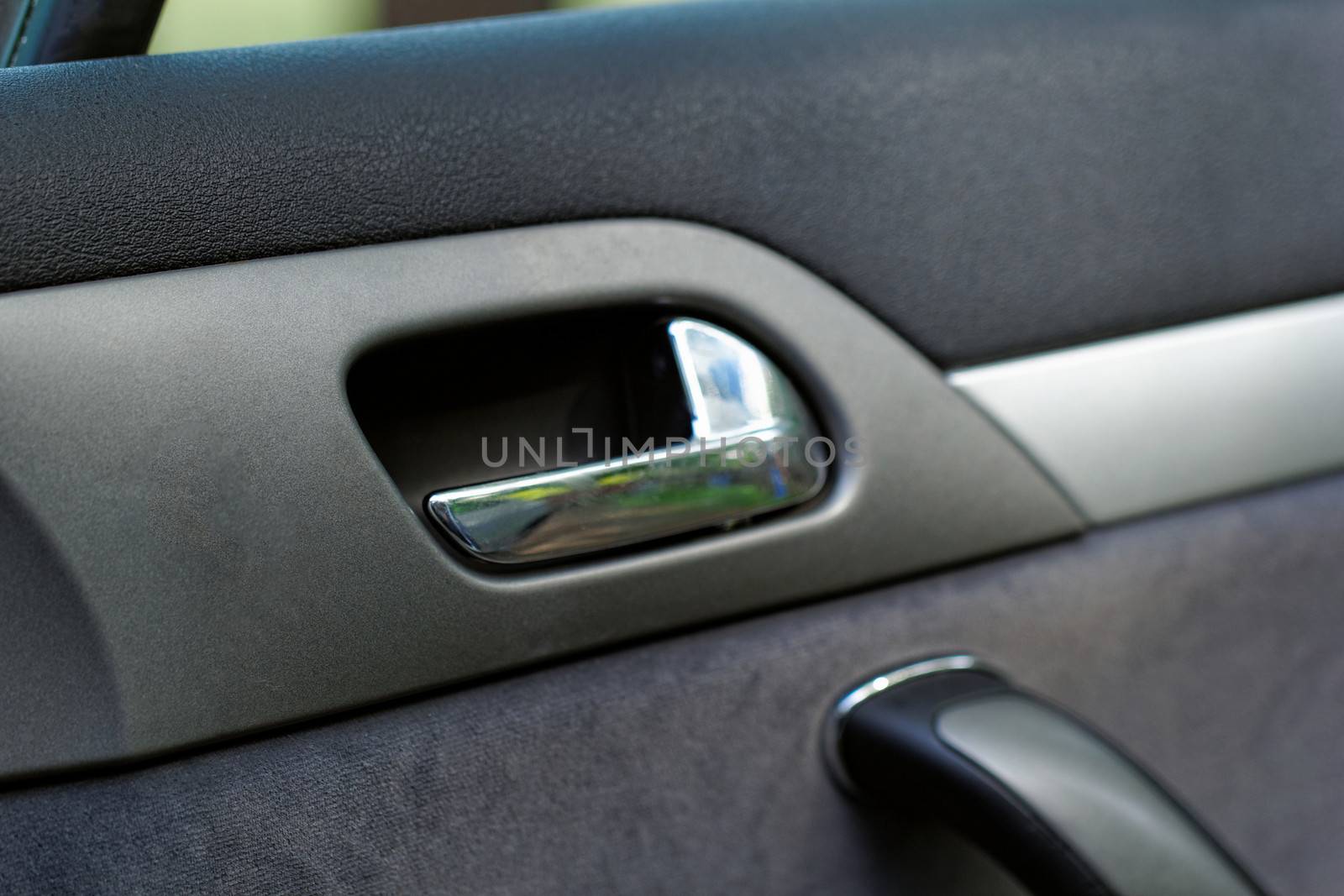 car door handle on a grey door