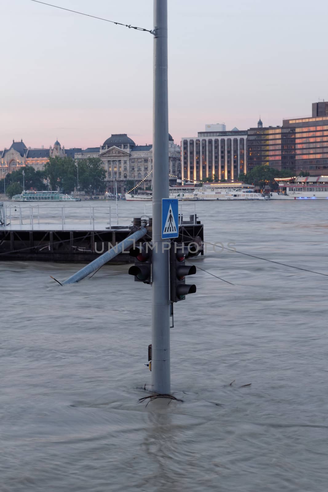 traffic light on flooding river