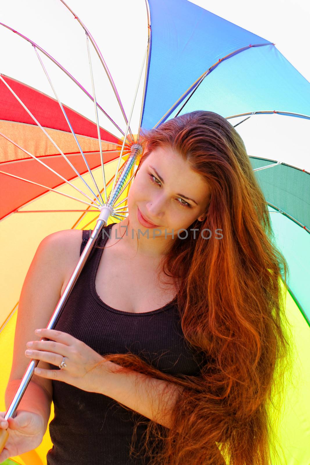 beautiful young girl with rainbow colored umbrella by NagyDodo