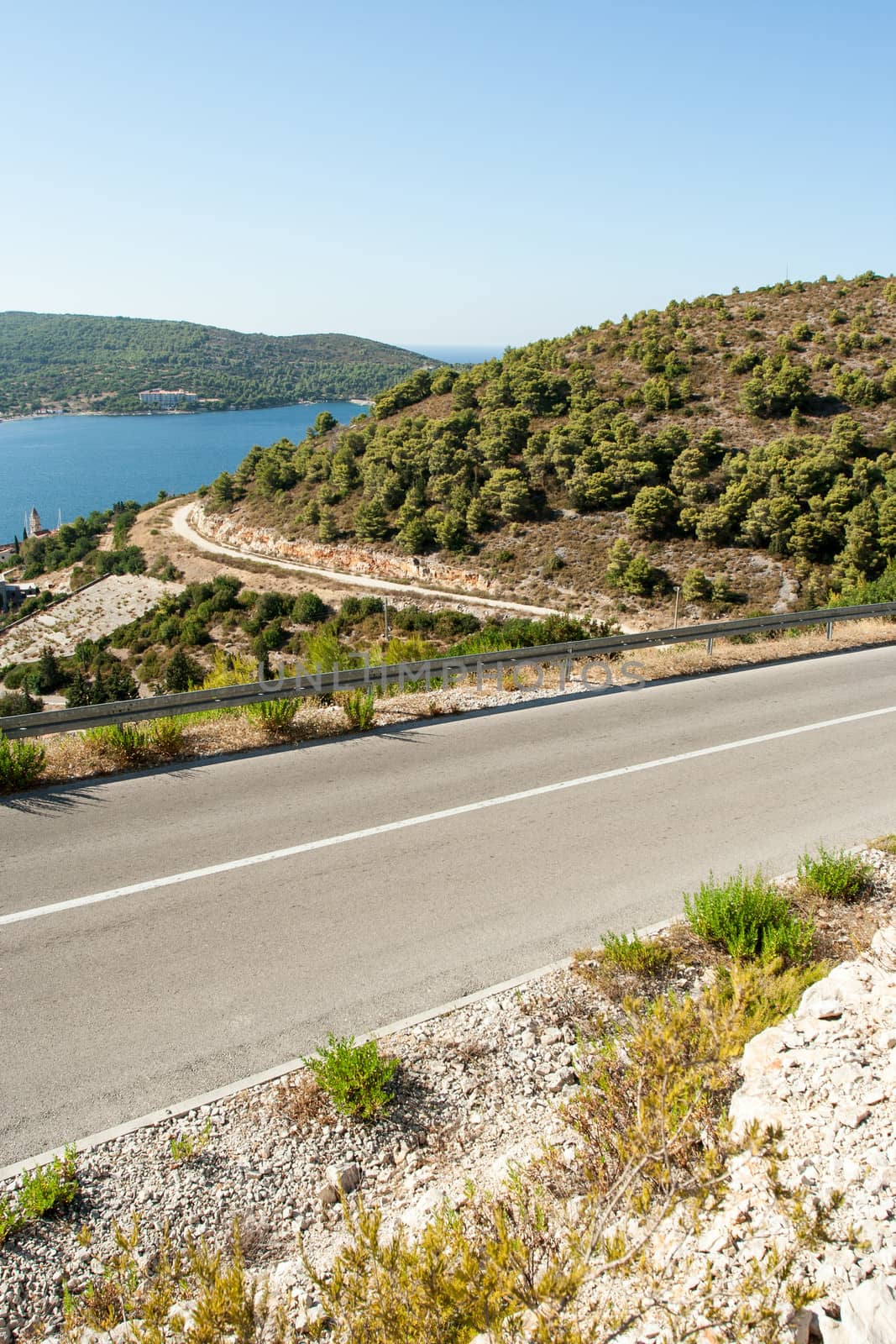 winding road in deserted landscape by NagyDodo