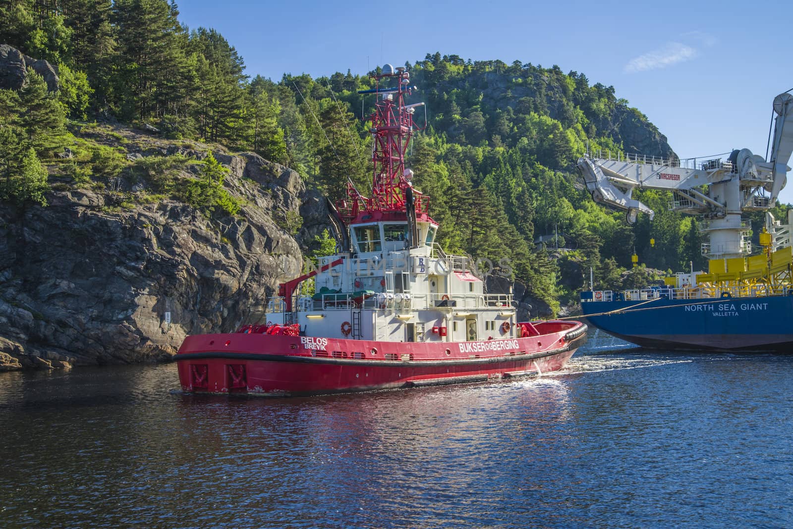 Tug Achilles and tug Belos have started towing the MV North Sea Giant through Ringdalsfjord in Halden, Norway.