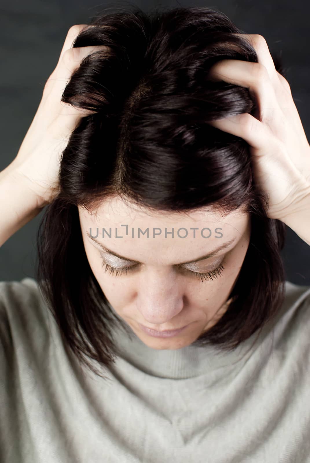 conceptual portrait of stressed abused young woman 