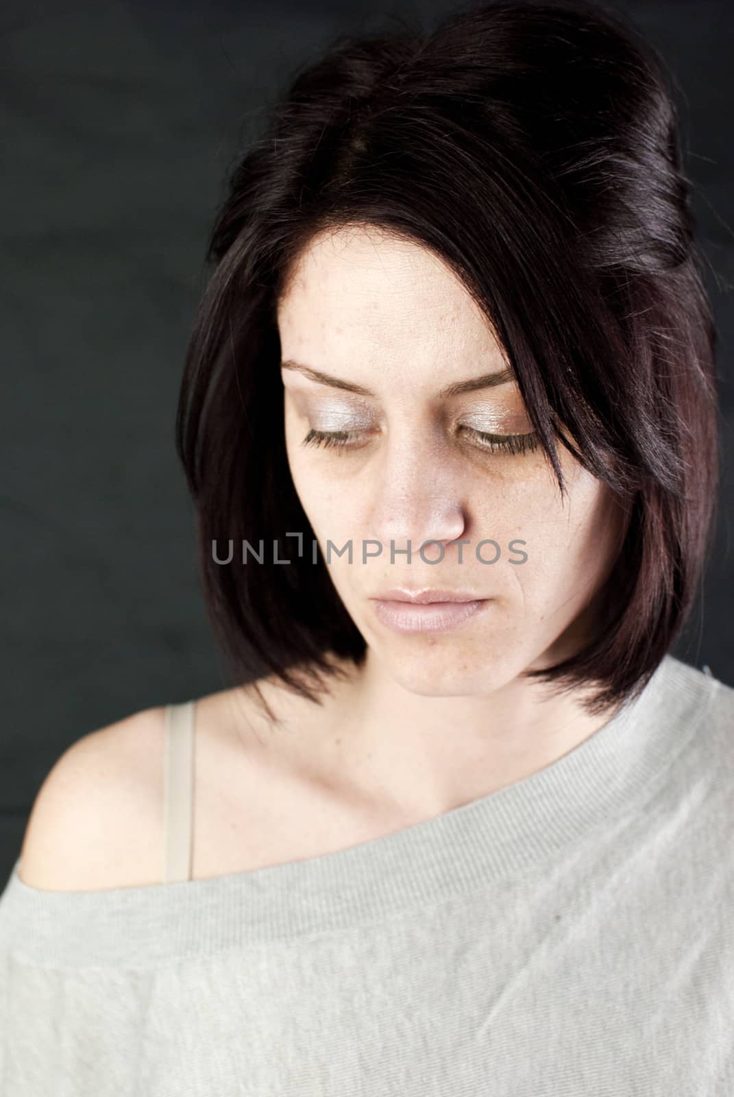 conceptual portrait of stressed abused young woman 