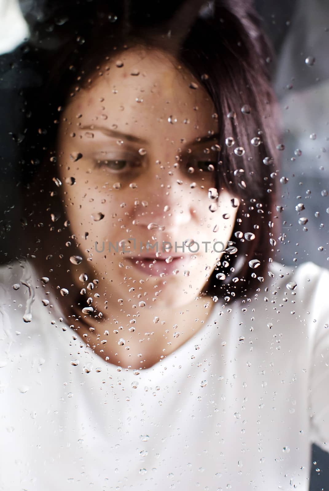 conceptual portrait of stressed abused young woman 