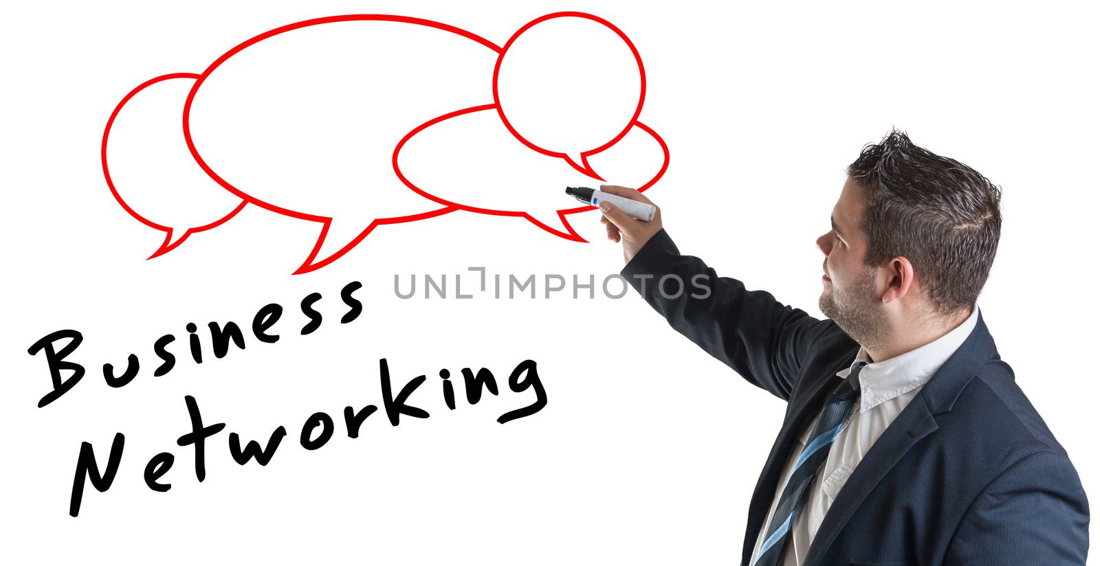 Businessman writing Network Concept on Whiteboard