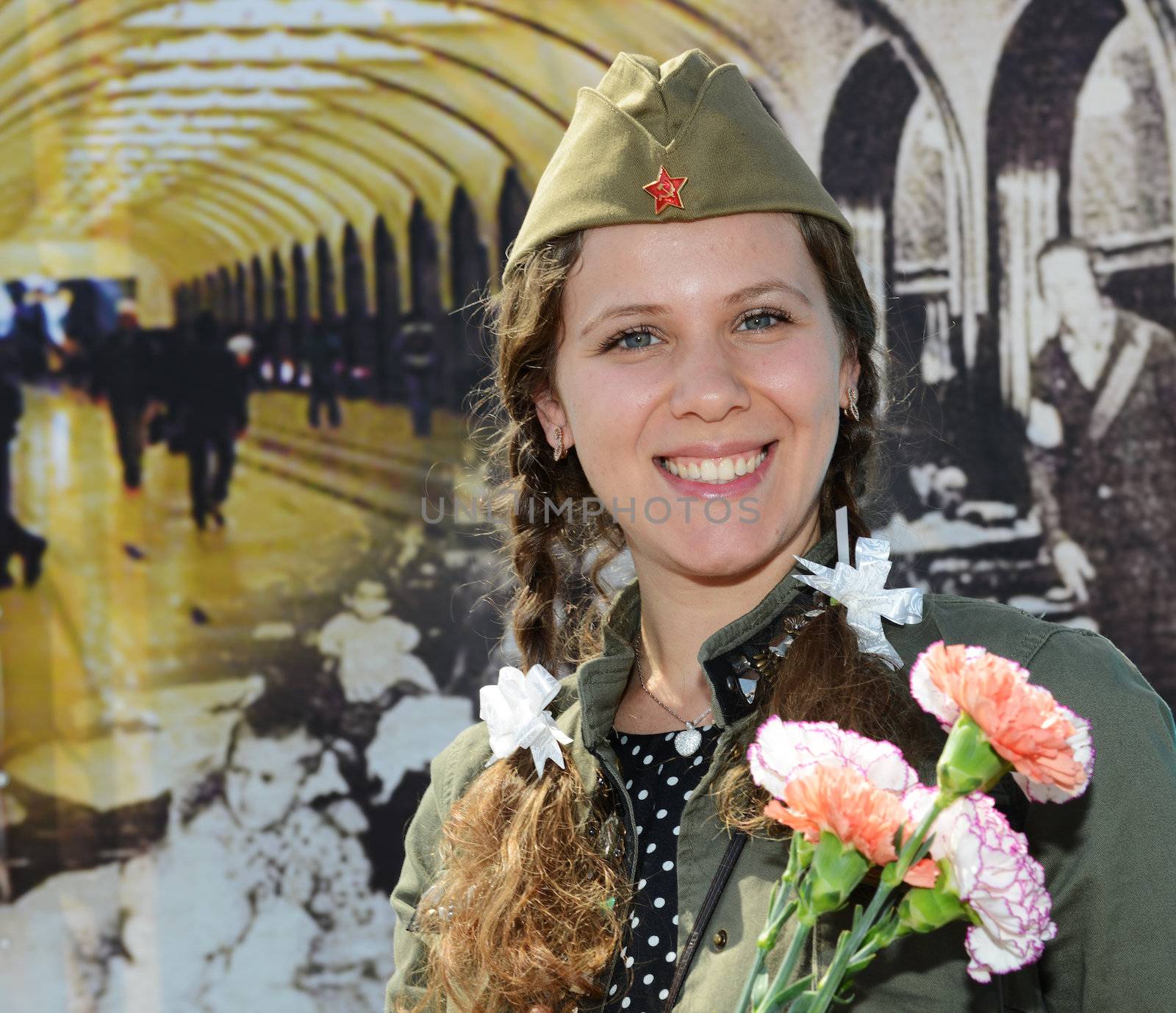  Moscow, Russia - May 9, 2013: Portrait of young girl in uniform decorated bearing bunch of flowers during festivities devoted to 68th anniversary of Victory Day  