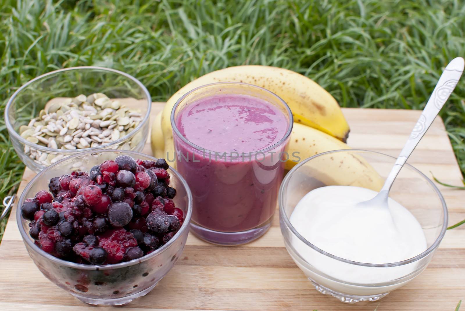 healthy berries juice smootie on wooden board