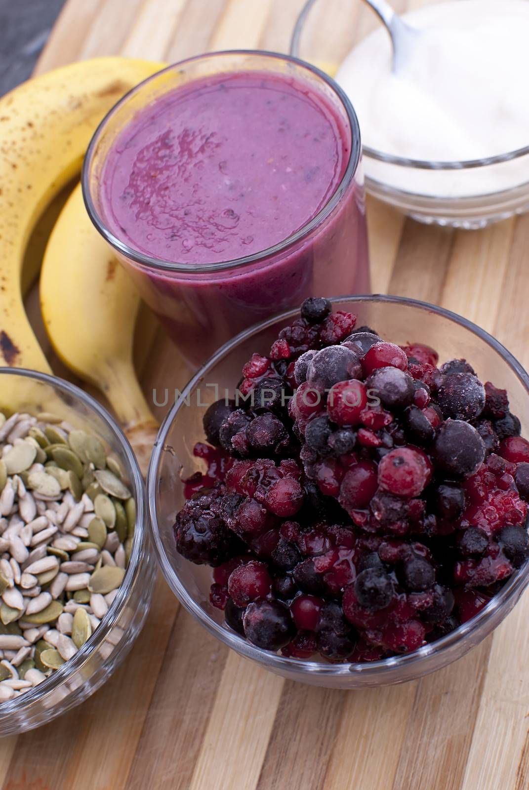 healthy berries juice smootie on wooden board