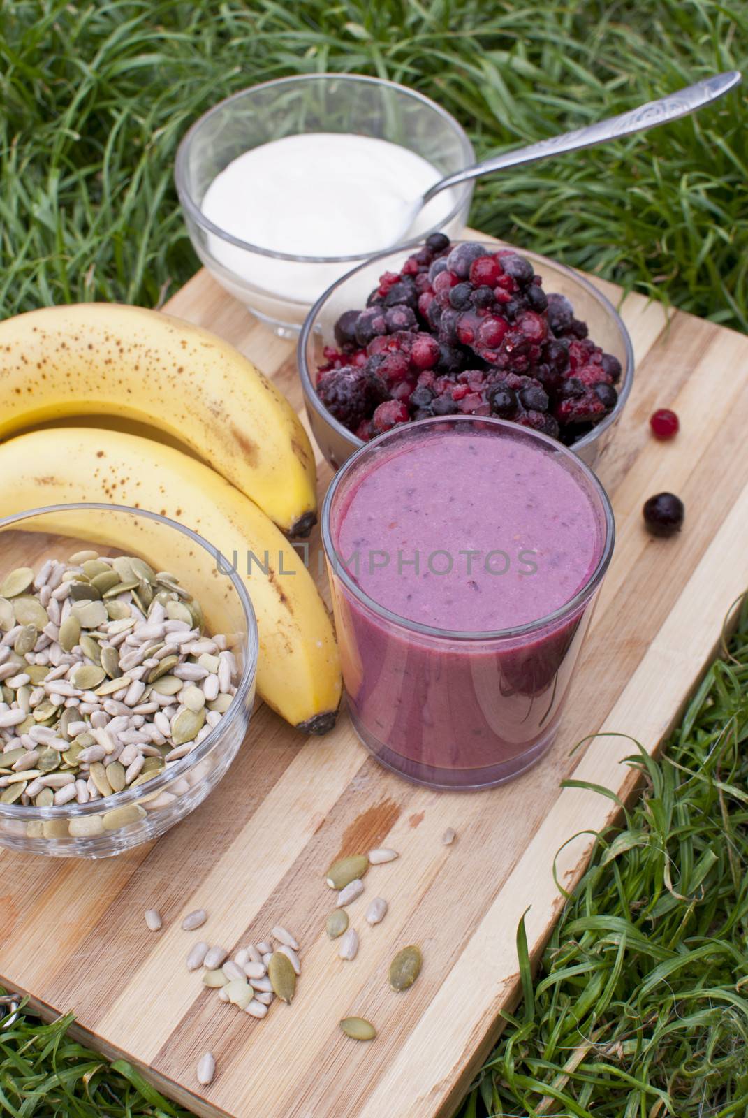 healthy berries juice smootie on wooden board