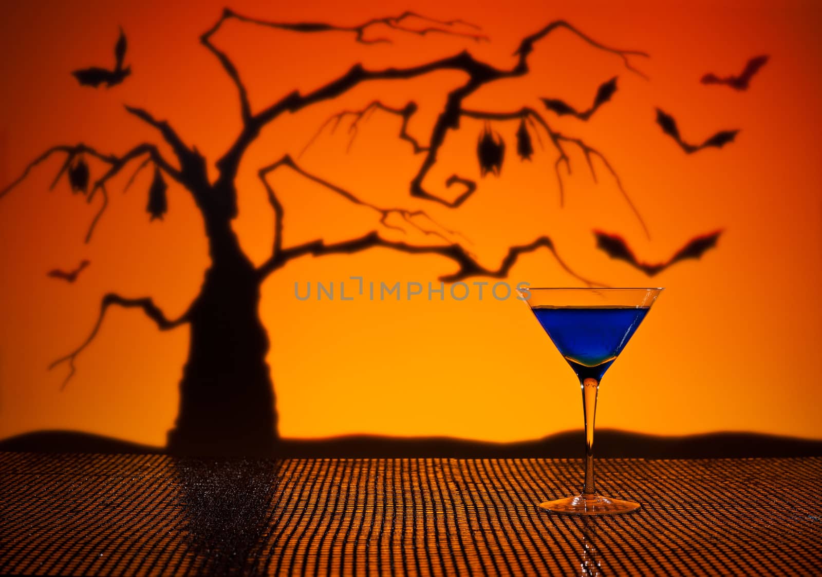 Cobalt Martini in Halloween setting with bats and a tree