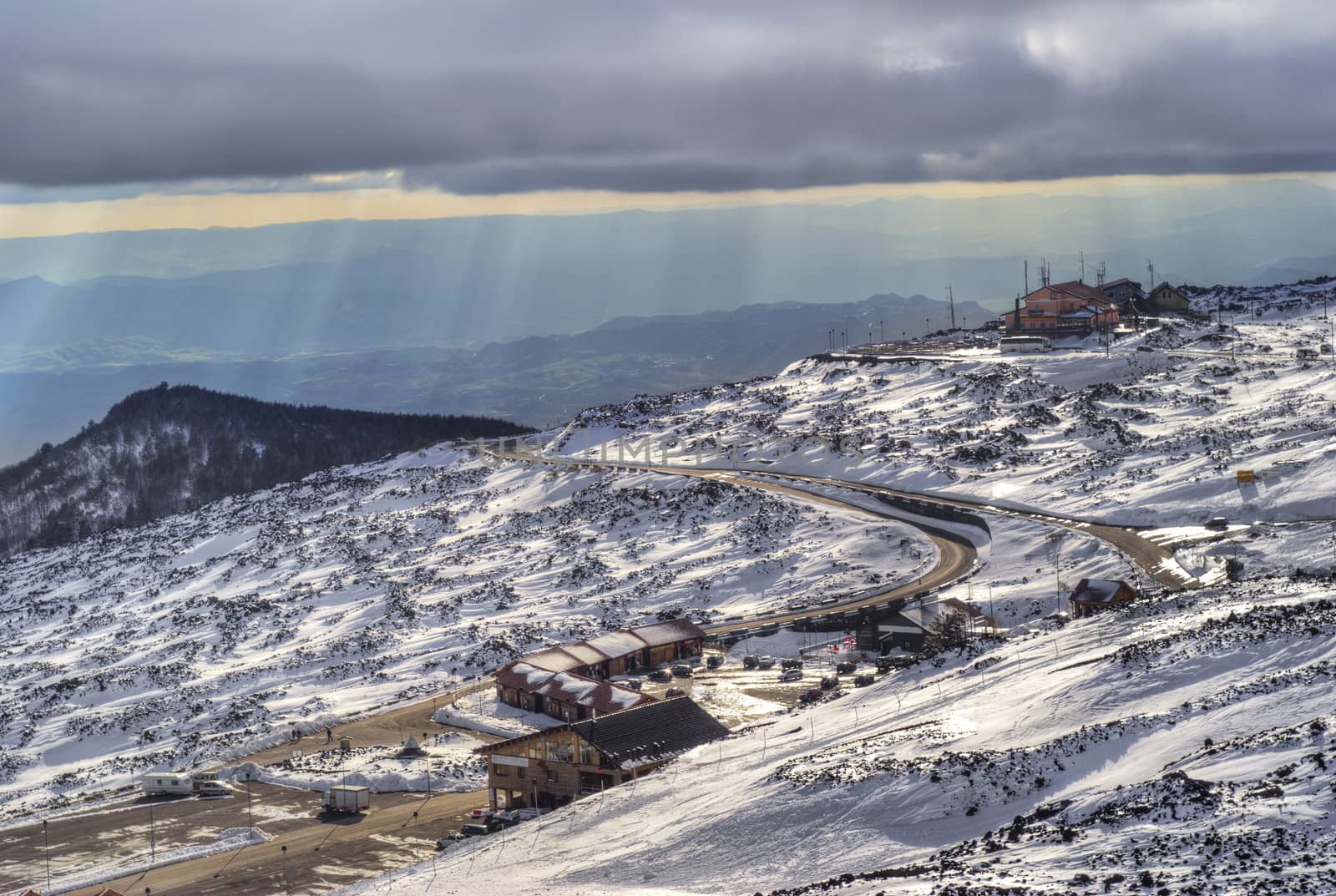 view of the ski resort illuminated by the rays of the sun. Etna volcano. sicily