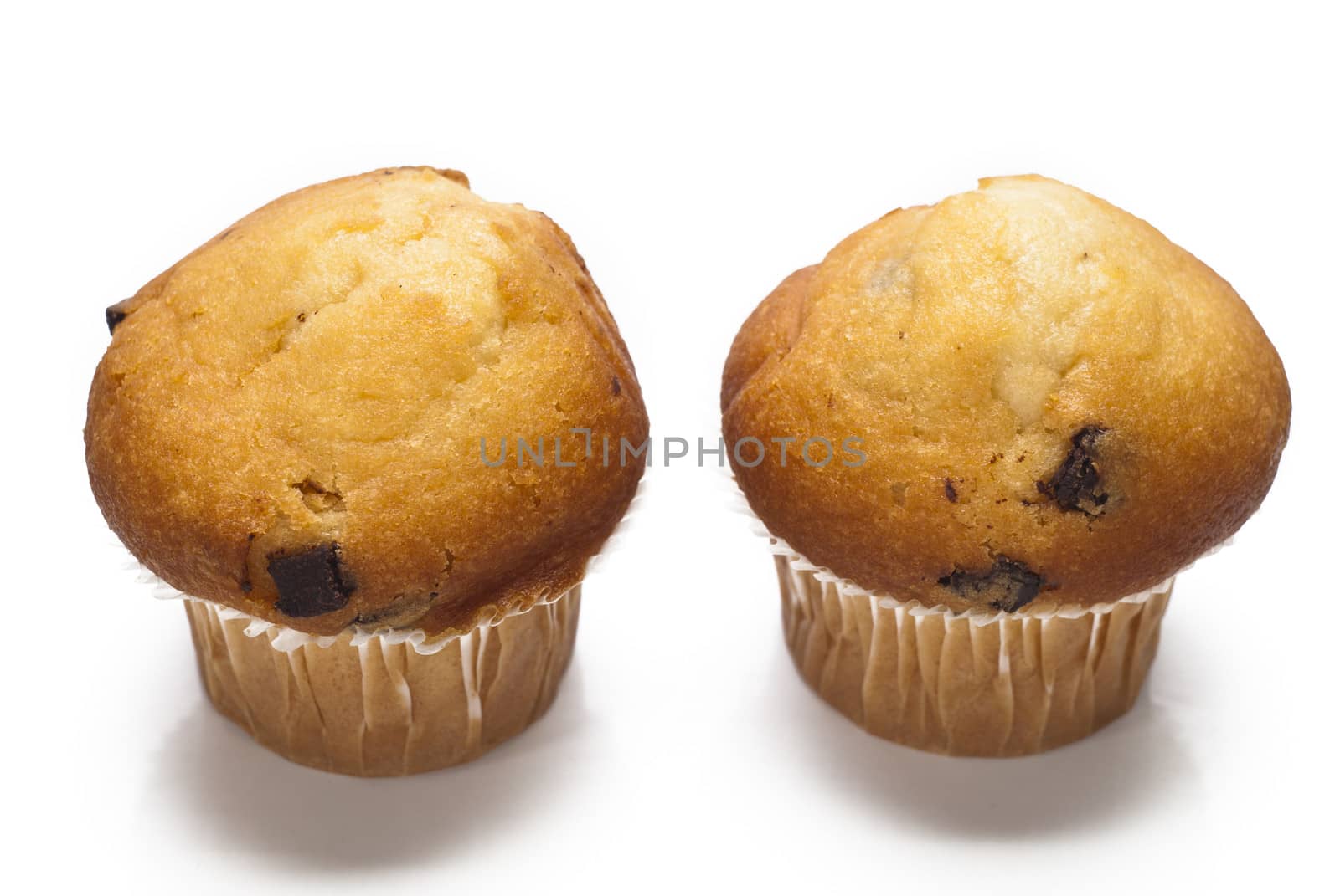 sweet muffins with chocolate drops isolated on a white background