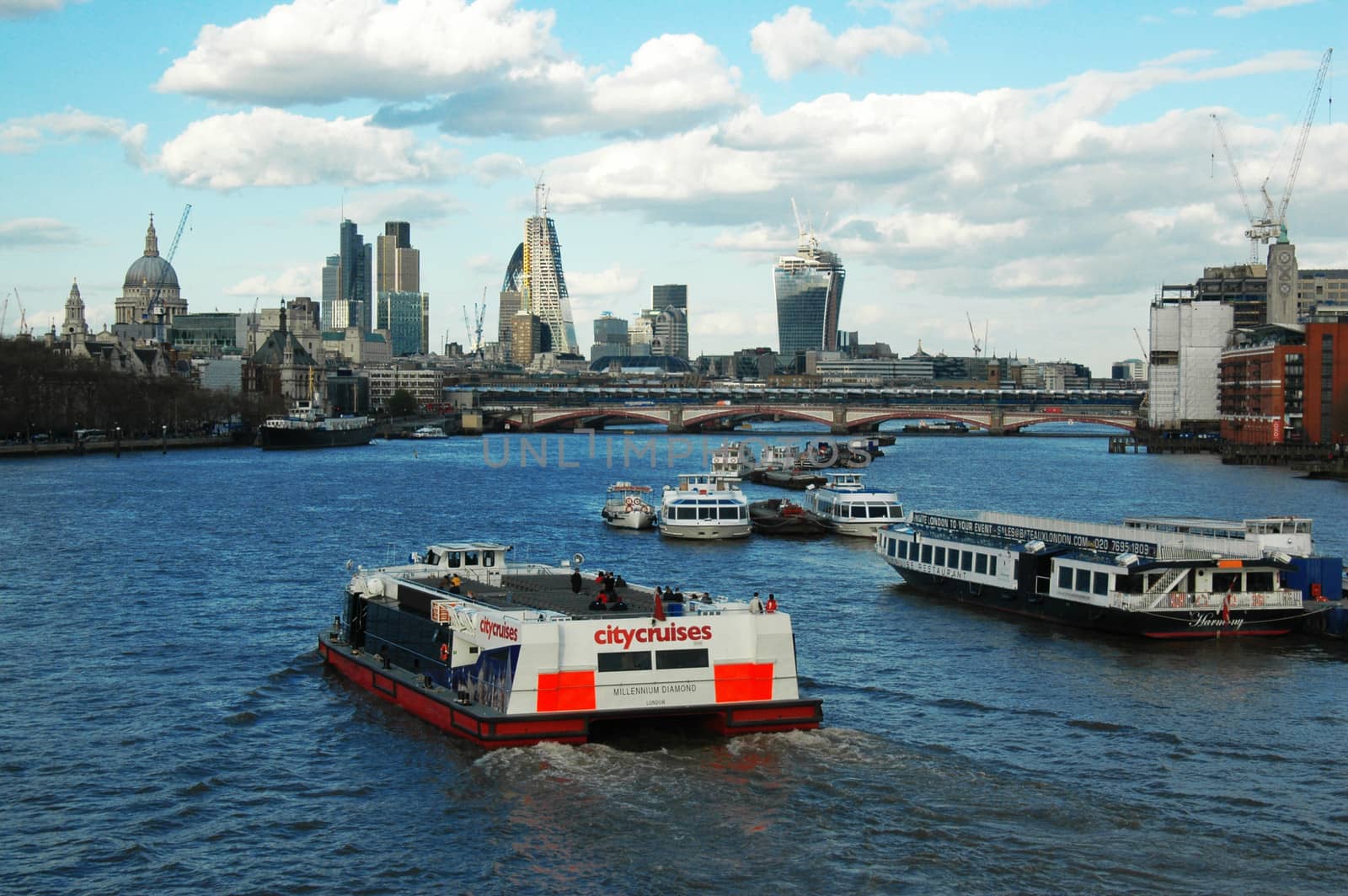 Floating boats on Thames, view from the bridge