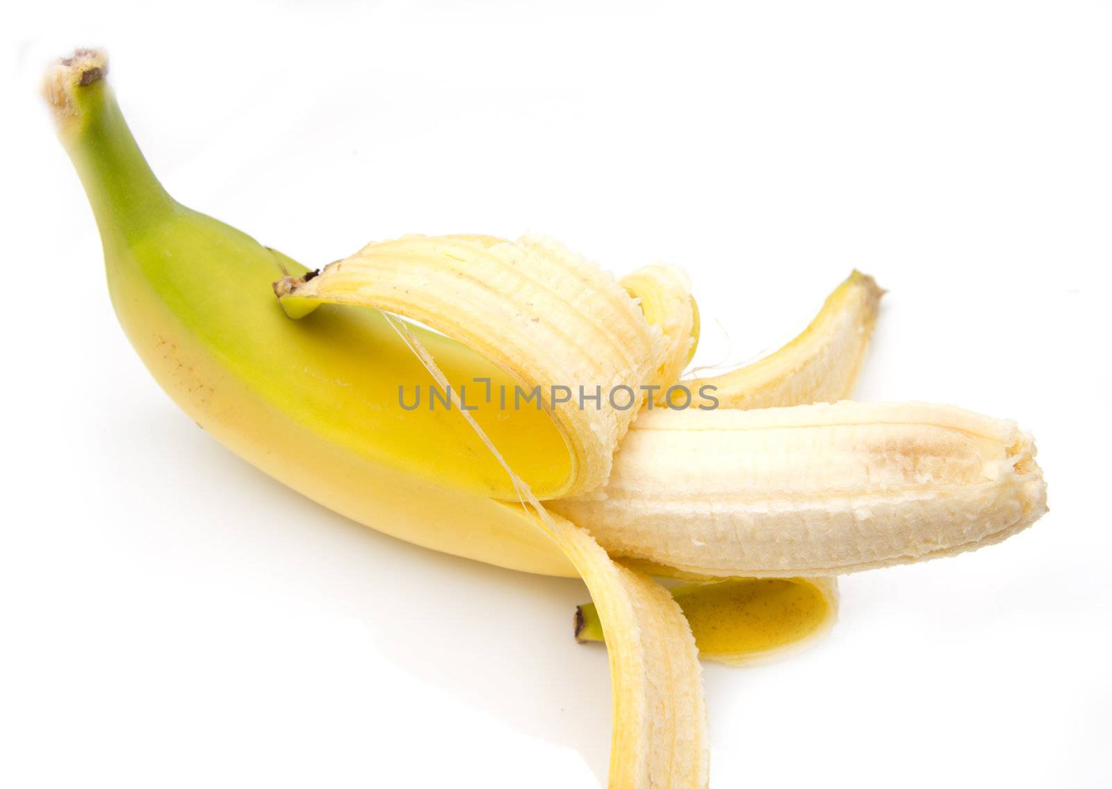 Close up of fresh banana over white background  by schankz