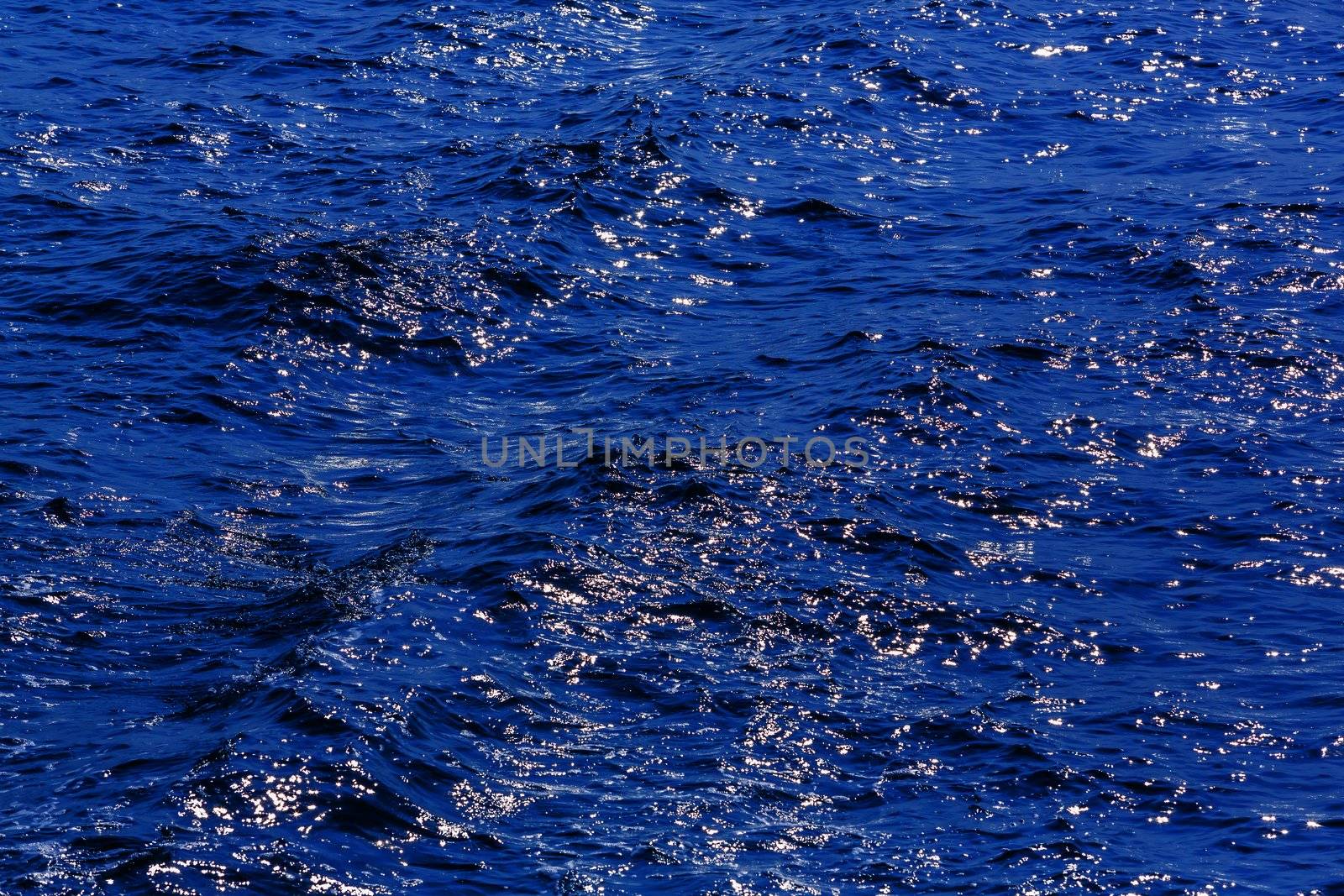 Abstract blue sea with reflection of sunlight