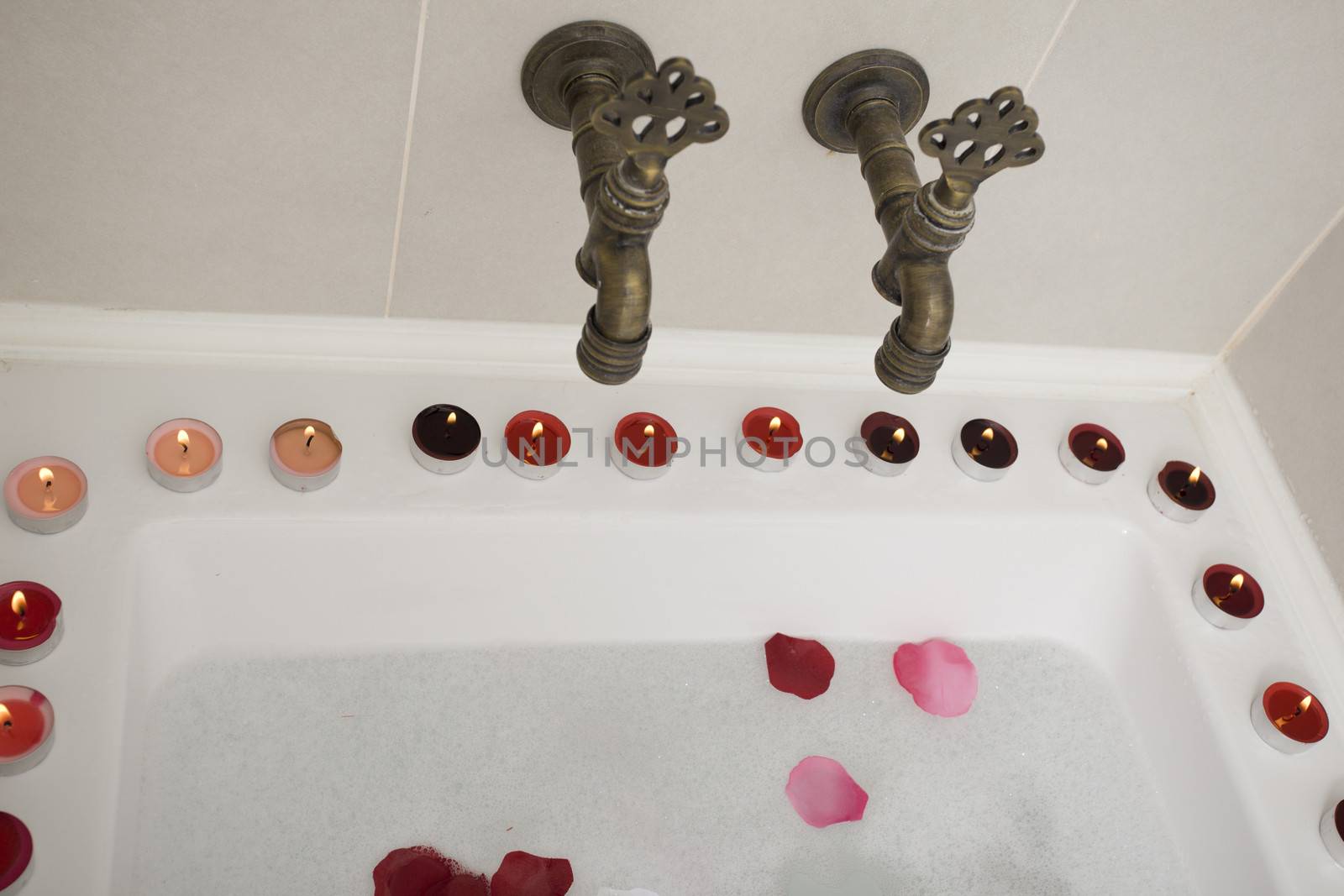 Bath water with rose petals  by senkaya