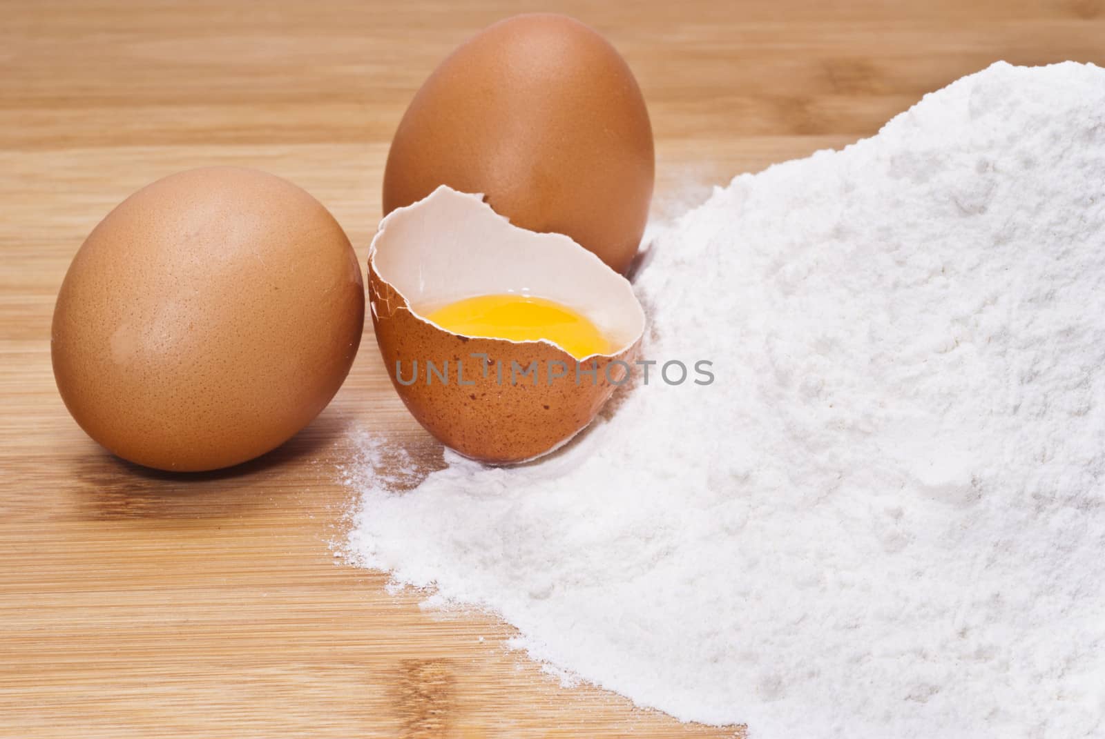 Eggs and flour. preparation of pasta on wooden table