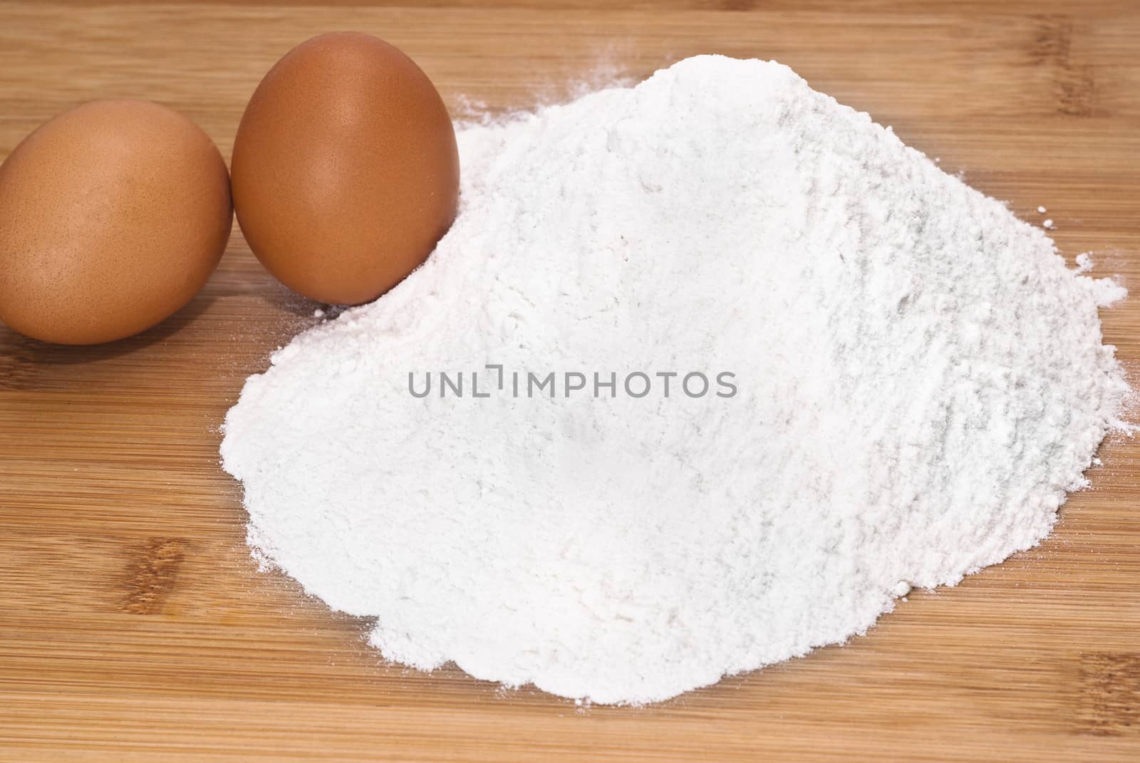 Eggs and flour. preparation of pasta on wooden table