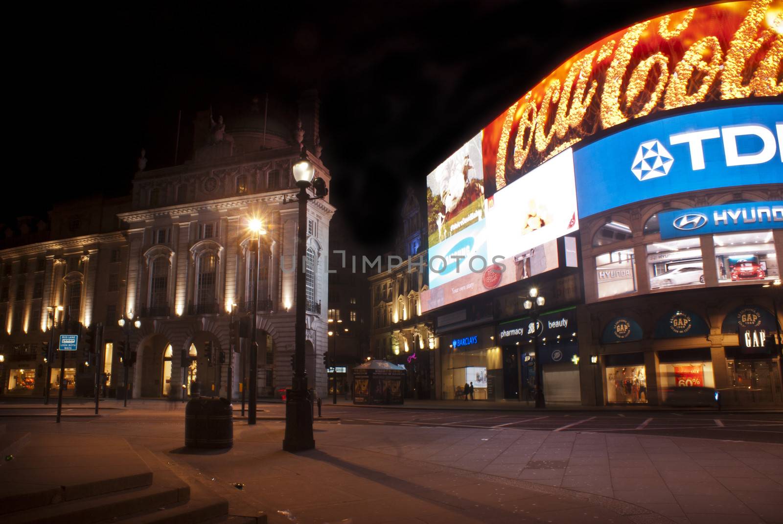 LONDON, ENGLAND APRIL 18: Famous Piccadilly Circus neon signage that has become a major attraction of London on April 18, 2013 in London, United Kingdom.