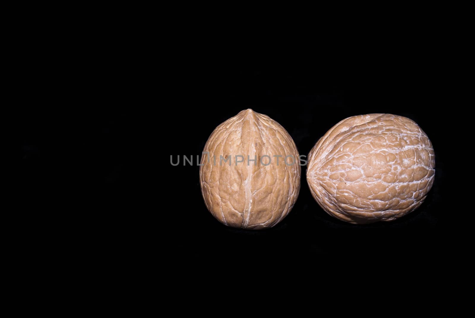 fresh walnuts isolated on a black background