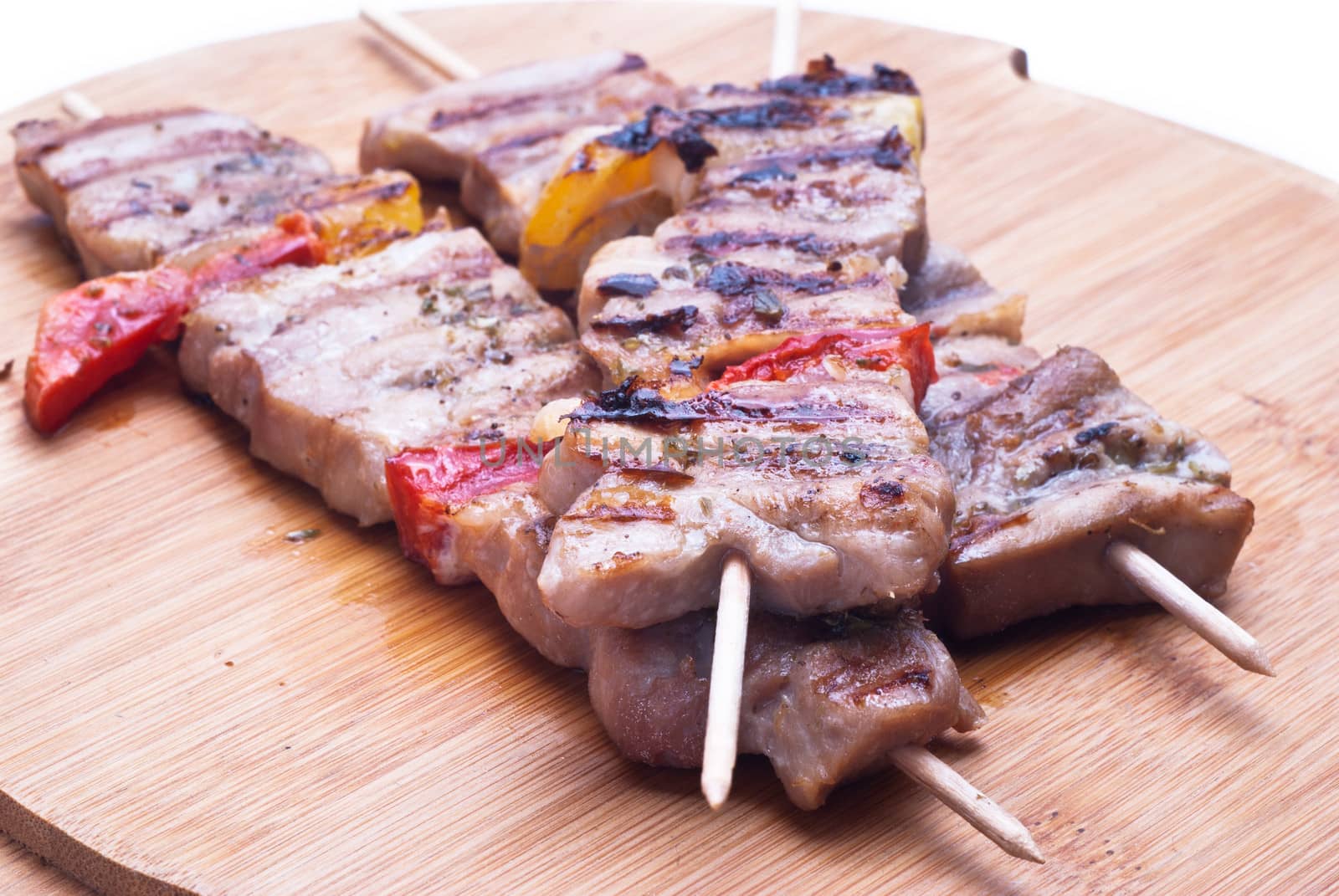 mixed meat skewer on wooden isolated on white background