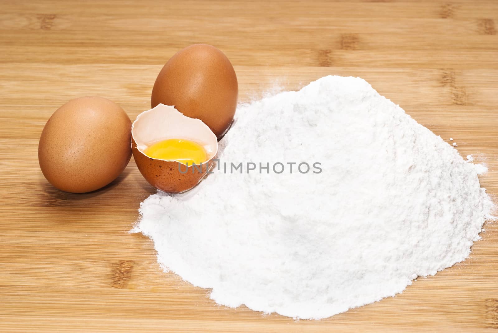 Eggs and flour. preparation of pasta on wooden table