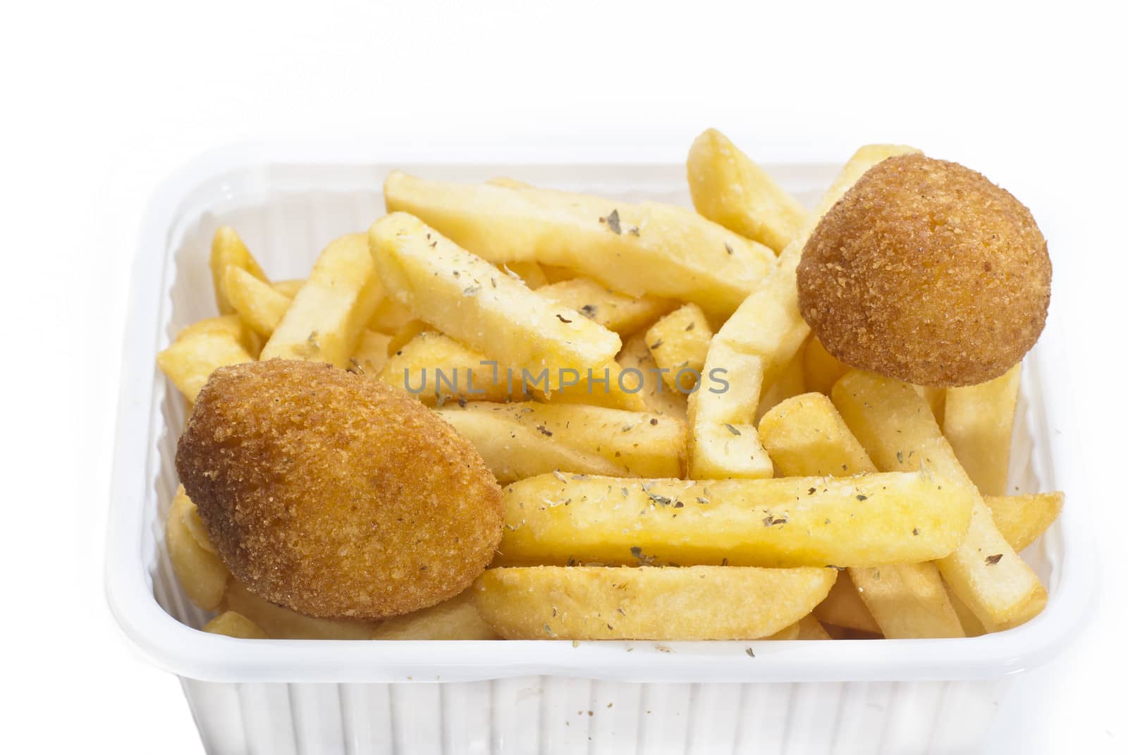 close up of basket of fries on white background