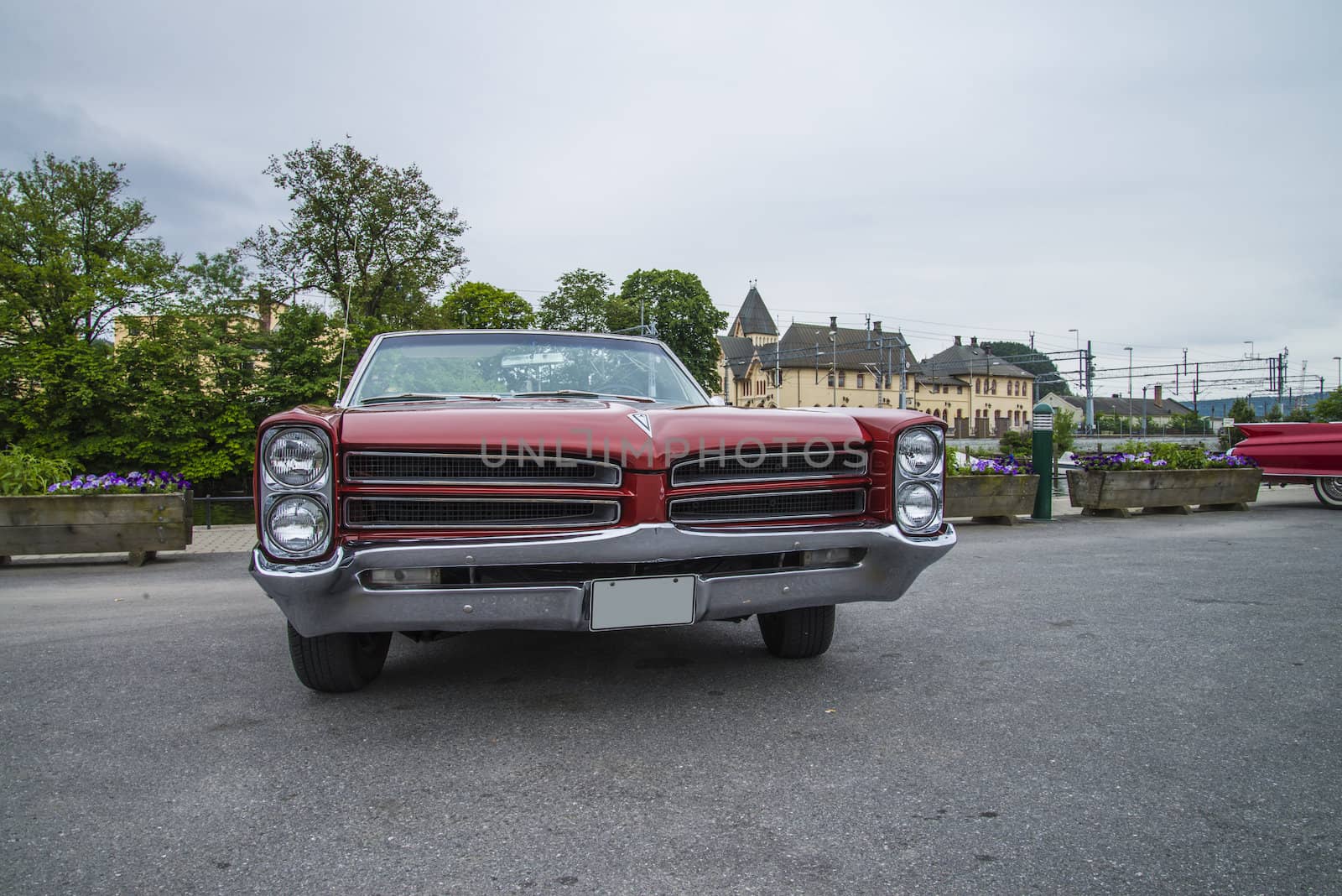 The image is shot at a fish-market in Halden, Norway where there every Wednesday during the summer months are held classic American car show.