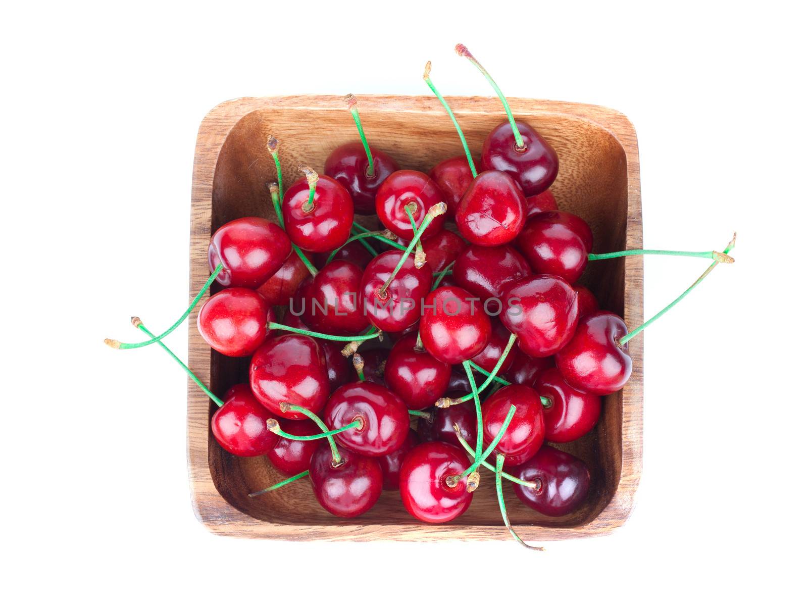 cherry berry in wooden bowl, isolated on white background