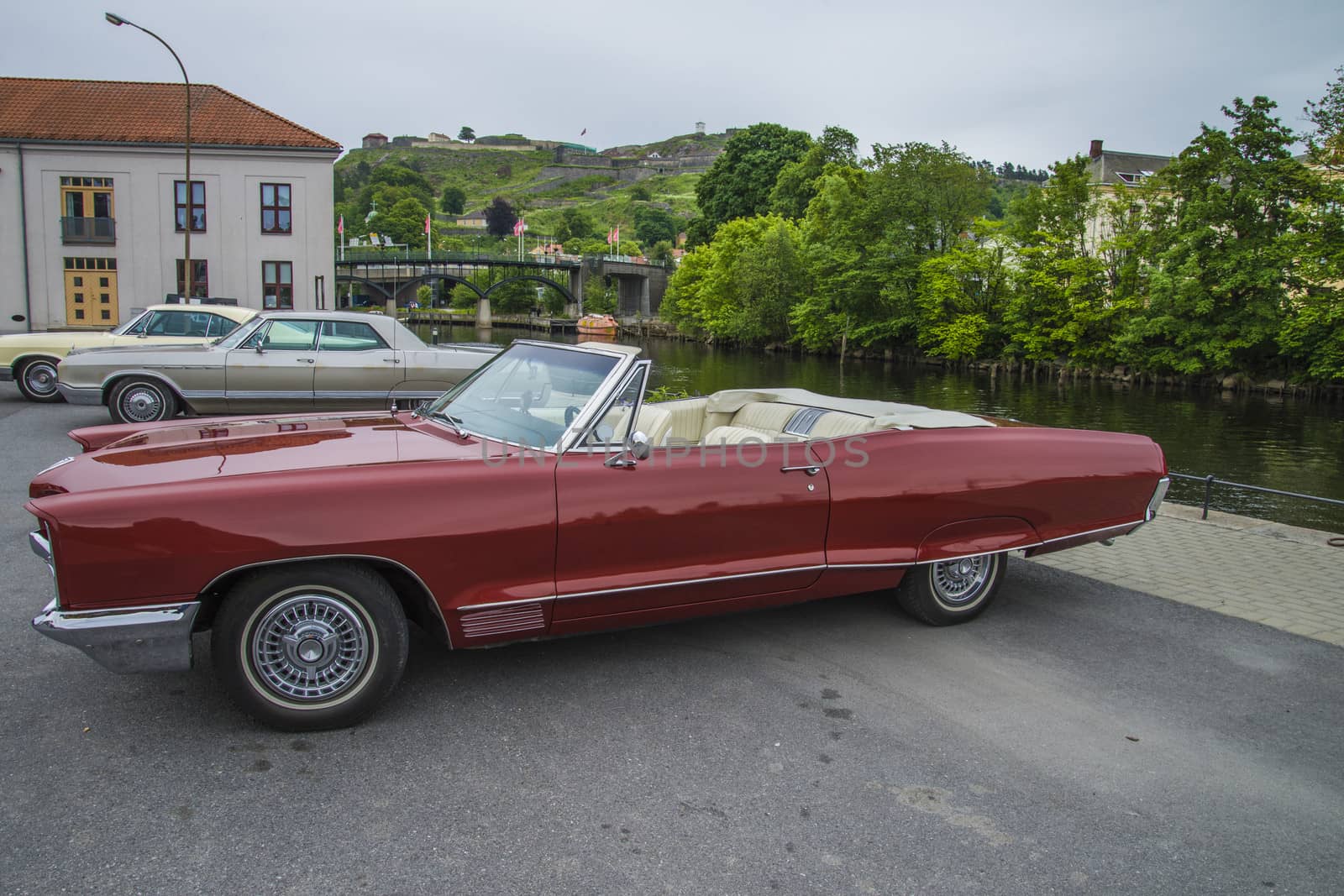 The image is shot at a fish-market in Halden, Norway where there every Wednesday during the summer months are held classic American car show.