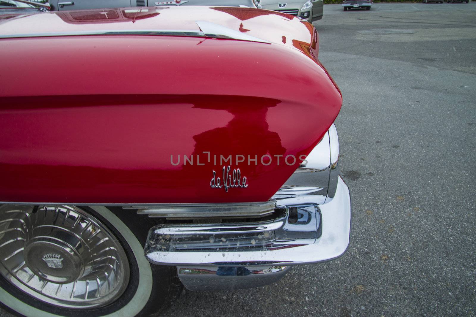 The image is shot at a fish-market in Halden, Norway where there every Wednesday during the summer months are held classic American car show.