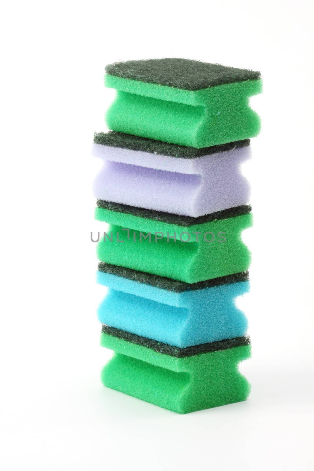 A pile of  kitchen sponges on white