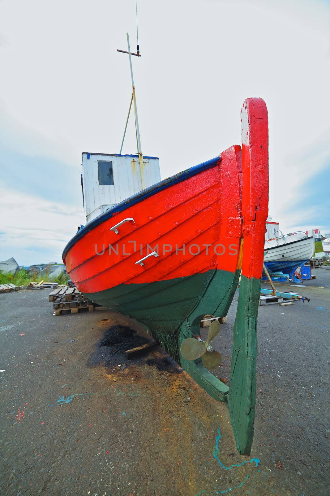 Fishing boats repair in the harbor of Husavik, Iceland
