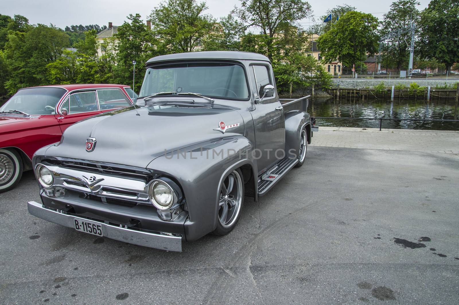 The image is shot at a fish-market in Halden, Norway where there every Wednesday during the summer months are held classic American car show.