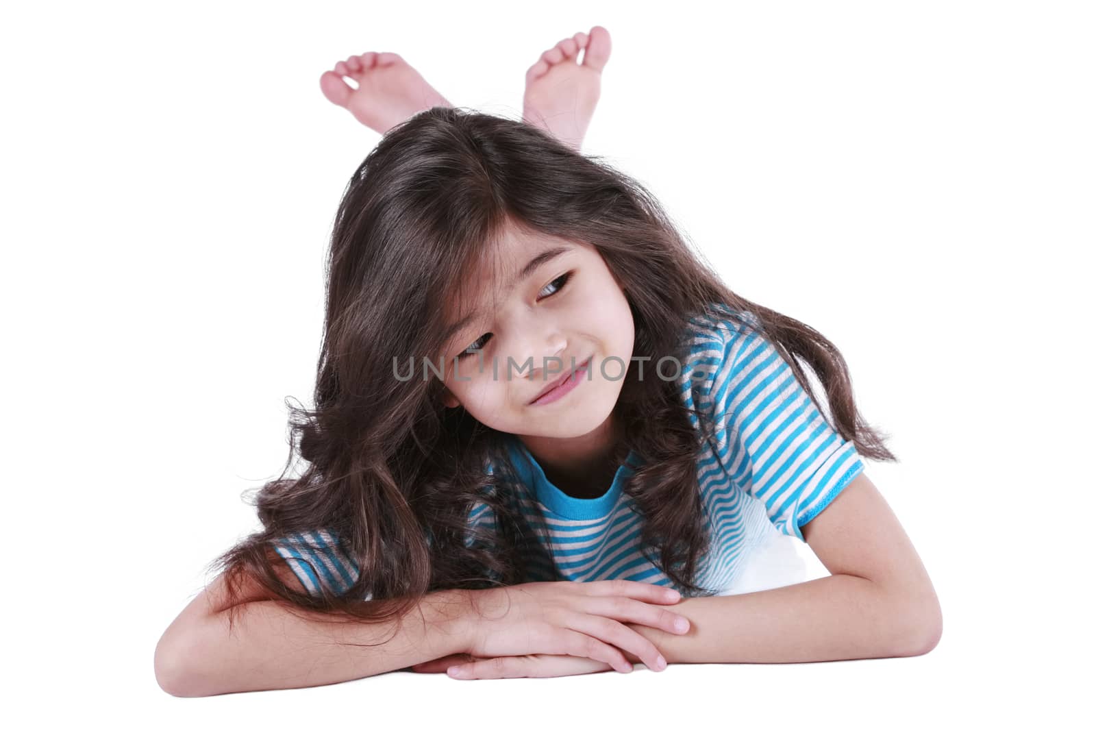 Seven year old girl lying down on floor, smiling by jarenwicklund