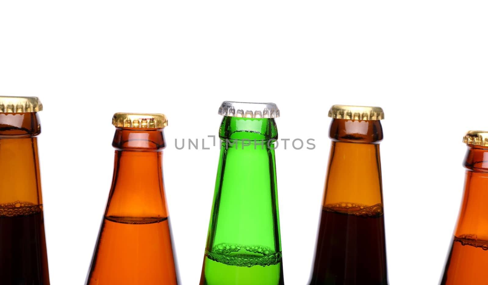A row of top beer bottlenecks on a white background with a reflection.