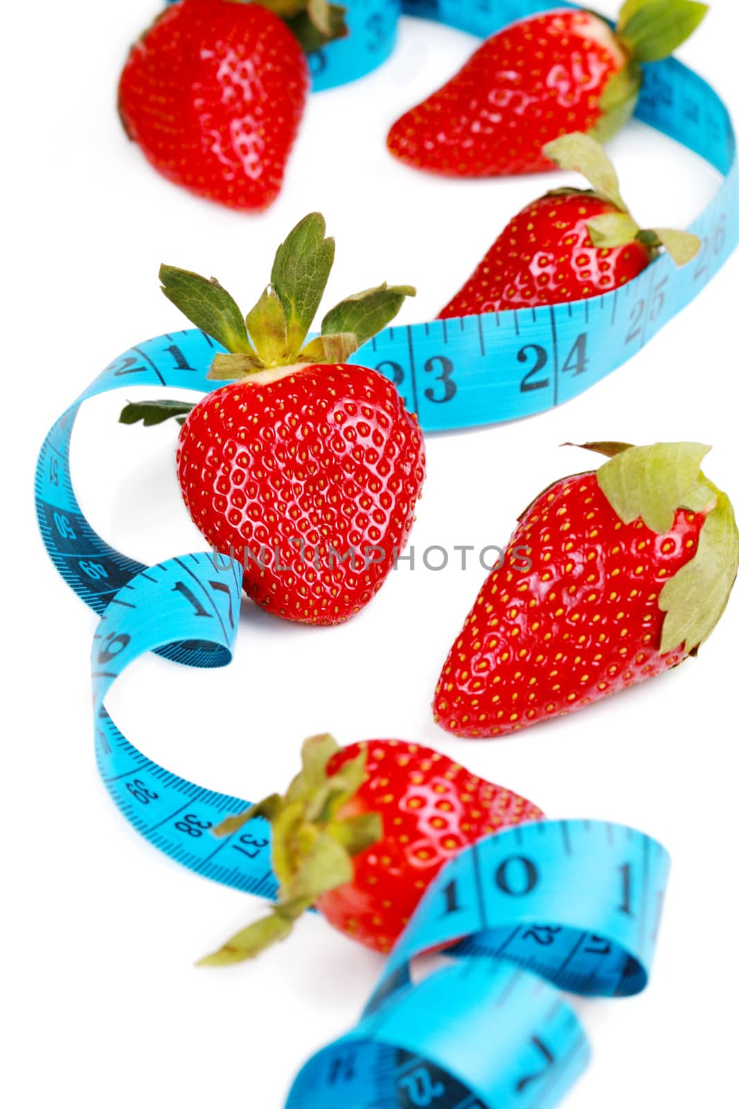 Healthy eating with fruit, strawberries. Berries with tape measure. health concept.