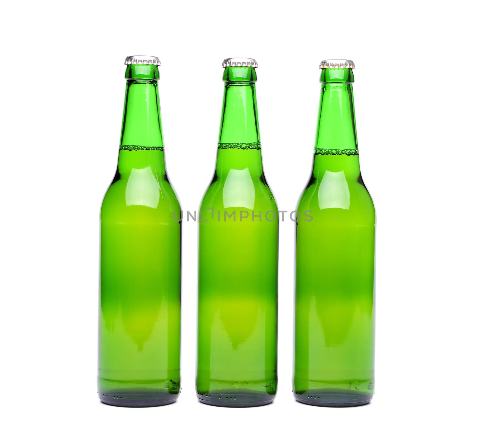 Three green beer bottle with drops drink without label on a white background
