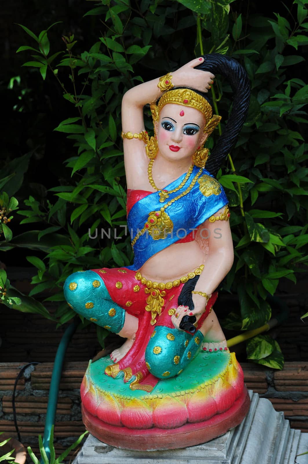 A colorful Buddha statue in a historical temple in Thailand